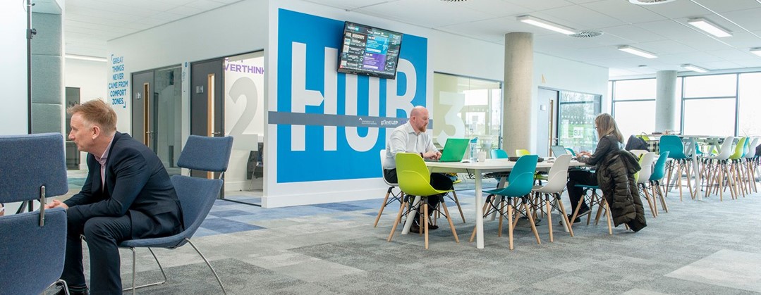 People working in the open space in the growth hub Gloucester